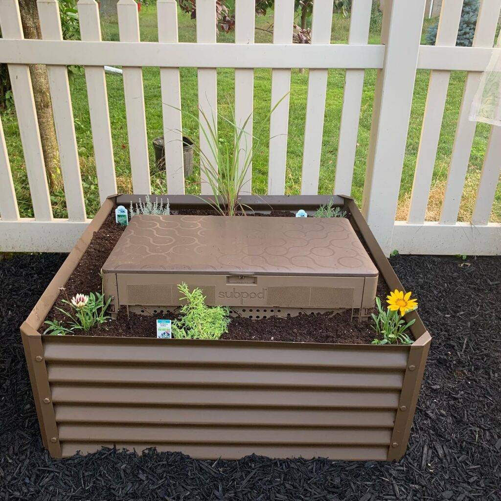 compost bin inside a metal raised garden bed