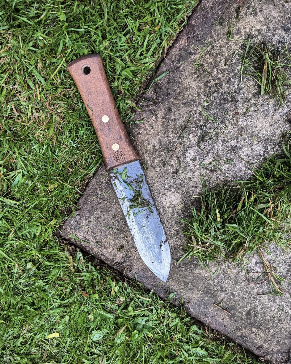 hori hori knife on cement block edge 